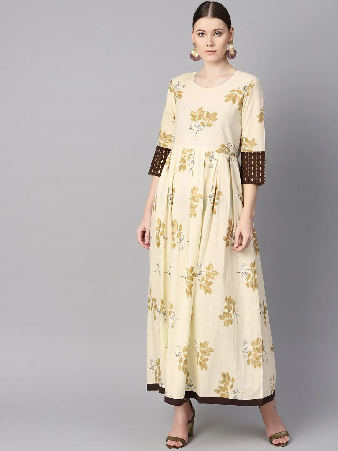 White Floral Gold Printed Round Neck 3/4Th Sleeve Printed Maxi With Brown Geometrical Gold Printed Jacket.